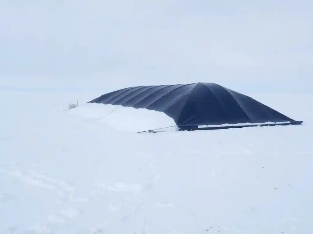 Scene depicting arctic conditions with geomembrane application, cold environment, snowy landscape